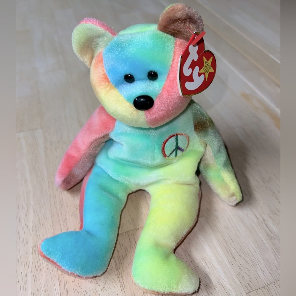 Ty Beanie Baby “Peace.” Perfect condition, stored in plastic.